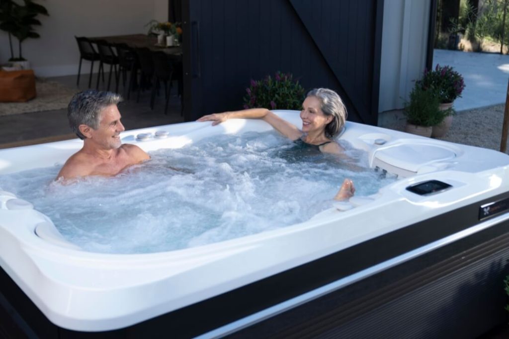 couple sitting in a hot tub